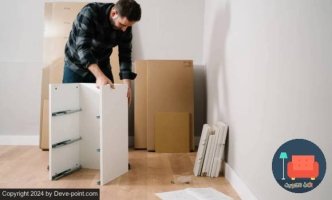 Furniture installation technician with cardboard 1 Furniture installation technician with cardboard 1